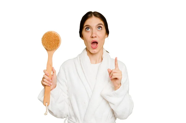 Young Caucasian Woman Holding Shower Brush Isolated Pointing Upside Opened — Stock Photo, Image