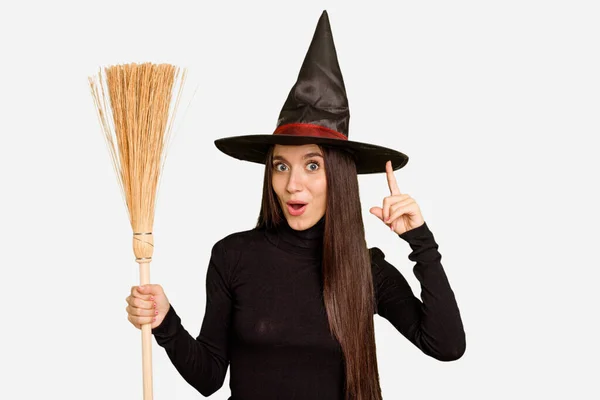 Young Caucasian Woman Dressed Witch Holding Broom Isolated Having Some — Stock Photo, Image