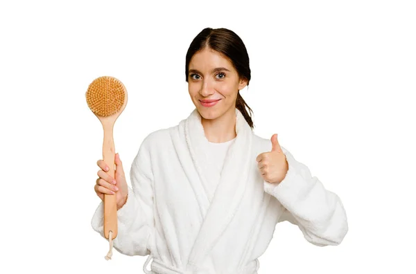 Young Caucasian Woman Holding Shower Brush Isolated Smiling Raising Thumb — Stock Photo, Image