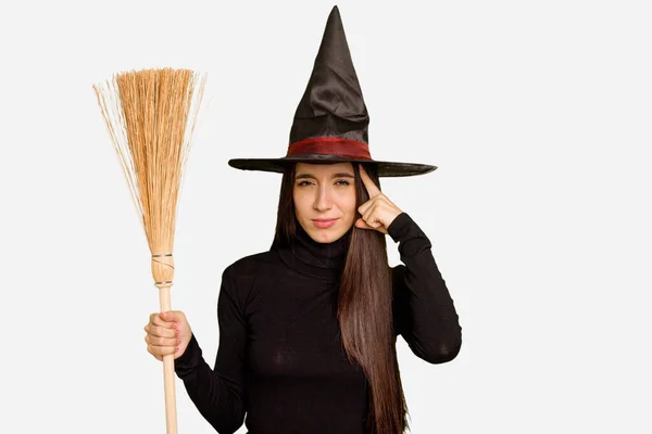 Young Caucasian Woman Dressed Witch Holding Broom Isolated Pointing Temple — Stock Photo, Image