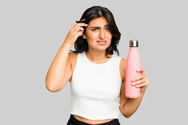 Young Indian Woman Holding Thermo Isolated Showing Disappointment Gesture Forefinger — Stock Photo, Image