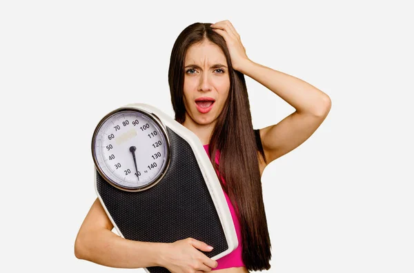 Young Caucasian Woman Holding Scale Isolated Being Shocked She Has — Stock Photo, Image