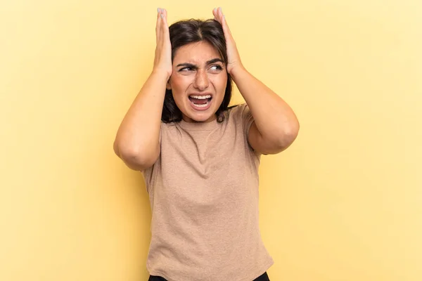 Young Indian Woman Isolated Yellow Background Covering Ears Hands Trying — Stock Photo, Image