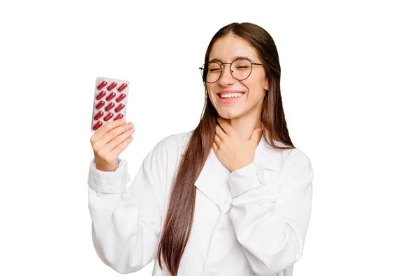 Young Pharmacist Woman Holding Tablet Pills Isolated Laughs Out Loudly — Stock Photo, Image