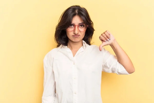 Young Indian Woman Isolated Yellow Background Showing Thumb Disappointment Concept — Stock Photo, Image