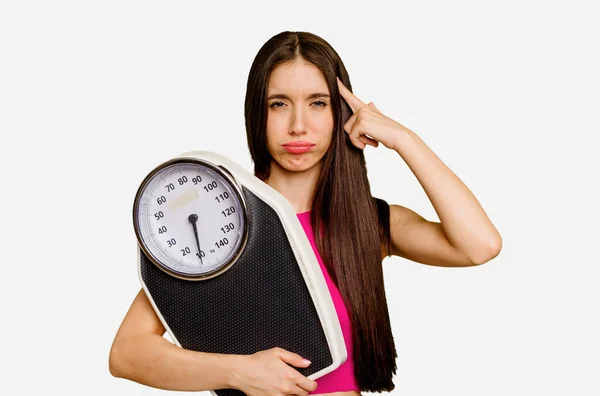 Young Caucasian Woman Holding Scale Isolated Showing Disappointment Gesture Forefinger — Stock Photo, Image