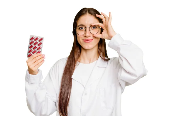 Young Pharmacist Woman Holding Tablet Pills Isolated Excited Keeping Gesture — Stock Photo, Image