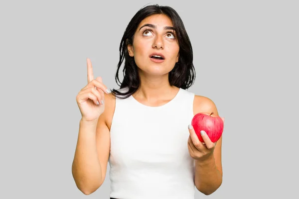Young Indian Woman Holding Apple Healthy Lifestyle Isolated Pointing Upside — Stock Photo, Image