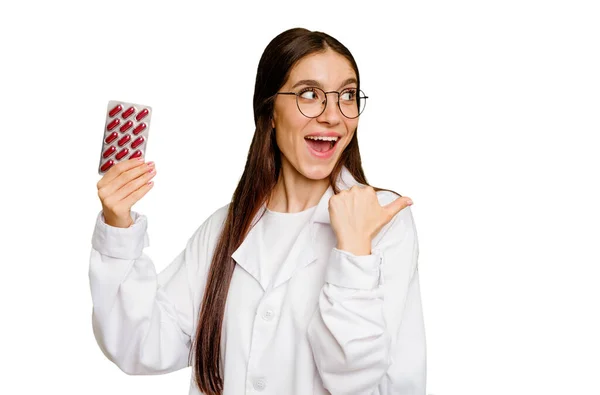 Young Pharmacist Woman Holding Tablet Pills Isolated Points Thumb Finger — Stock Photo, Image