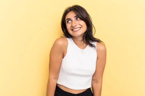 Young Indian Woman Isolated Yellow Background Laughs Closes Eyes Feels — Stock Photo, Image