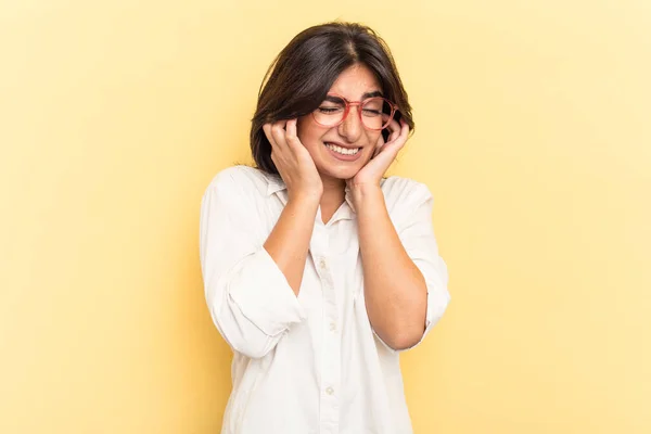 Young Indian Woman Isolated Yellow Background Covering Ears Hands — Stock Photo, Image