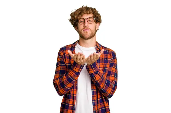 Young Caucasian Man Isolated Green Chroma Background Holding Something Palms — Stock Photo, Image