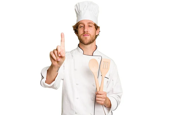Mladý Kuchař Muž Izolované Bílém Pozadí Ukazující Číslo Jedna Prstem — Stock fotografie
