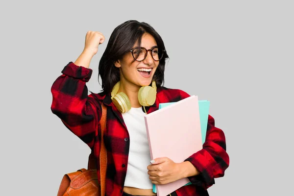 Young Student Indian Woman Wearing Headphones Isolated Raising Fist Victory — Stock Photo, Image