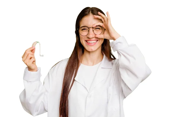Young Otorhinolaryngologist Caucasian Woman Holding Hearing Aid Isolated Excited Keeping — Stock Photo, Image
