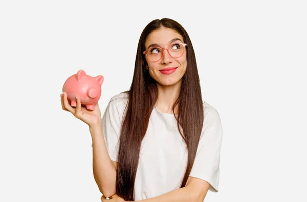 Young Caucasian Woman Holding Piggy Bank Isolated Dreaming Achieving Goals — Stock Photo, Image