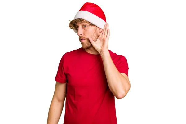 Νεαρός Καυκάσιος Που Φοράει Χριστουγεννιάτικο Καπέλο Απομονωμένος Λευκό Φόντο Προσπαθώντας — Φωτογραφία Αρχείου