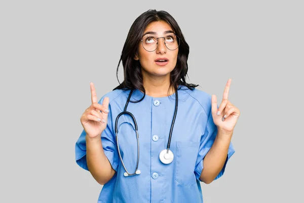 Young Nurse Indian Woman Isolated Pointing Upside Opened Mouth — Stock Photo, Image