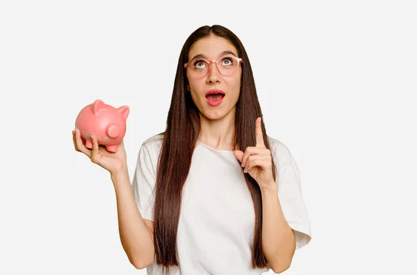 Young Caucasian Woman Holding Piggy Bank Isolated Pointing Upside Opened — Stock Photo, Image