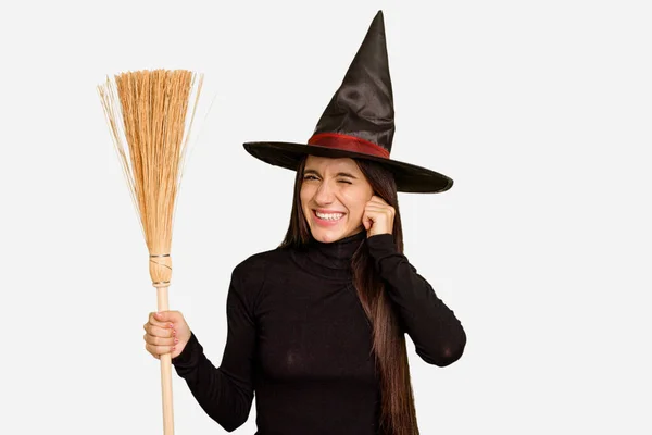 Young Caucasian Woman Dressed Witch Holding Broom Isolated Covering Ears — Stock Photo, Image