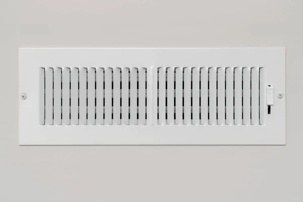 4 in x 12 in air register vent with white powder coating mounted on a wall
