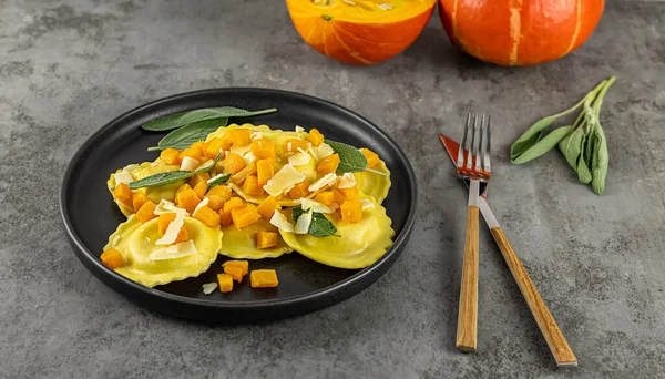 Seasonal autumn recipe. Pumpkin ravioli with sage, parmesan, and olive oil. Great meal for lunch or dinner, vegetarian food.