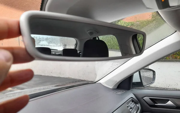 Car mirror while driving in the rain