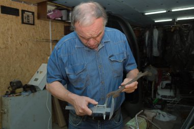 Working with a caliper. Master's hands at work. Home workshop