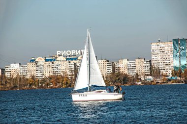 Dnepropetrovsk, Ukraine - 10.31.2021: White modern sailing ship sails on the Dnieper river.