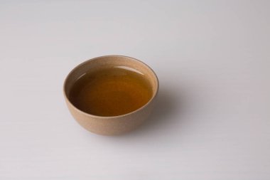 A cup of freshly brewed pu-erh tea. Traditional tea cup