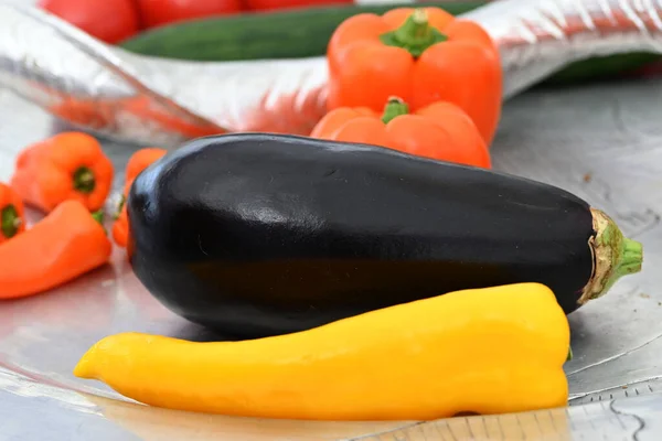 Healthy food orange bell pepper, yellow sweet pepper and aubergine. High quality photo