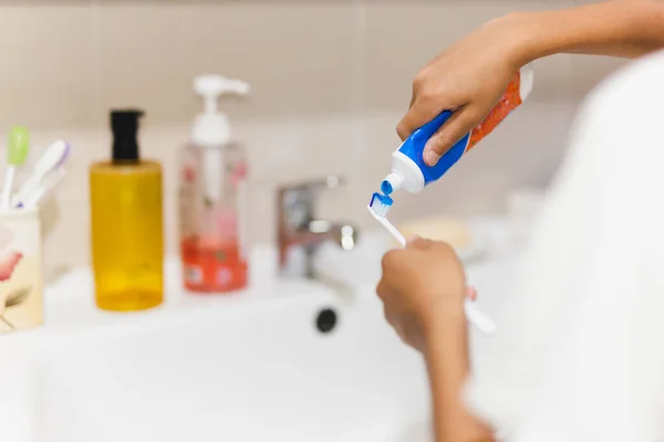 Boy Hand Putting Toothpaste Toothbrush Bathroom — Zdjęcie stockowe