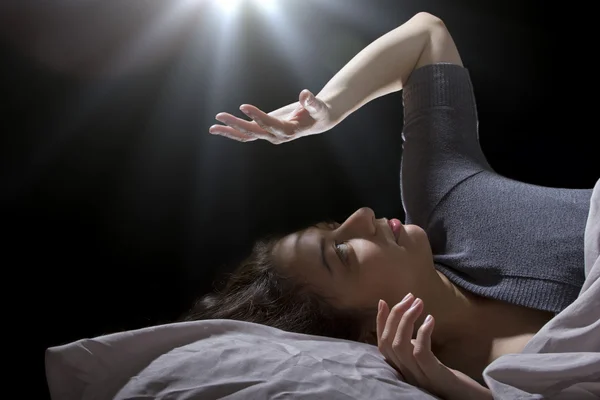 Light ball wakes woman — Stock Photo, Image