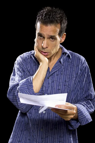 Stressed man reading bills — Stock Photo, Image