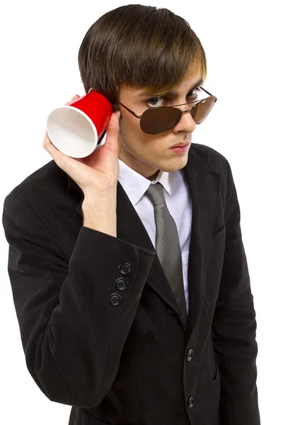 American spy holding a cup — Stock Photo, Image