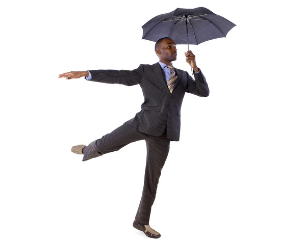 Uomo d'affari che balla con un ombrello — Foto Stock
