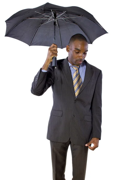 Affärsman som innehar ett paraply — Stockfoto