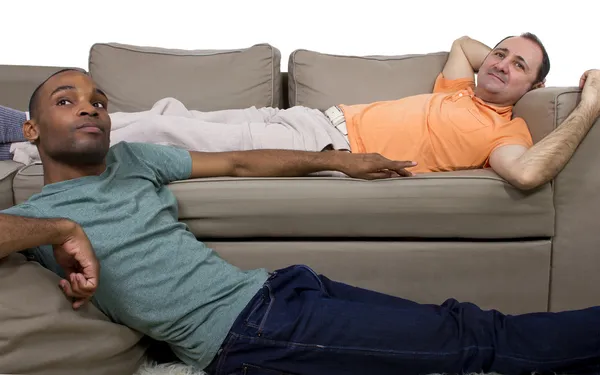 Two gay lovers relaxing in the livingroom — Stock Photo, Image