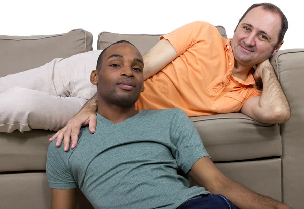 Two gay lovers relaxing in the livingroom — Stock Photo, Image