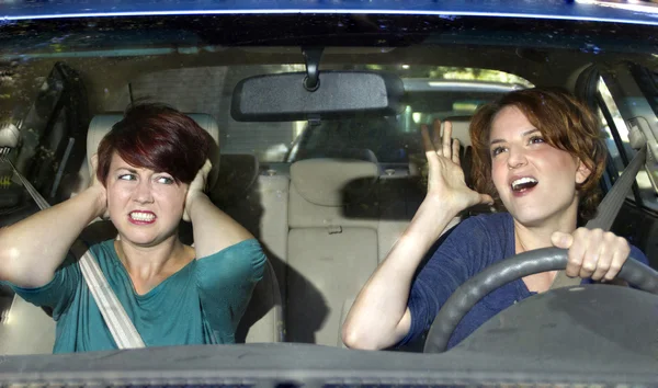 Passenger and singing female driver — Stock Photo, Image