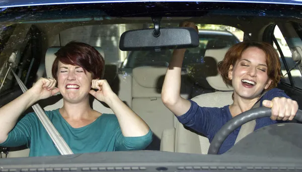 Passenger and singing female driver — Stock Photo, Image