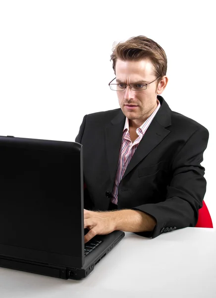 Hombre de negocios con un ordenador portátil — Foto de Stock