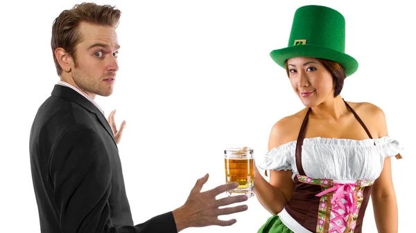 Woman in St Patty's costume serving customers — Stock Photo, Image