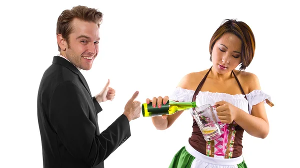 Woman in St Patty's costume serving customers — Stock Photo, Image