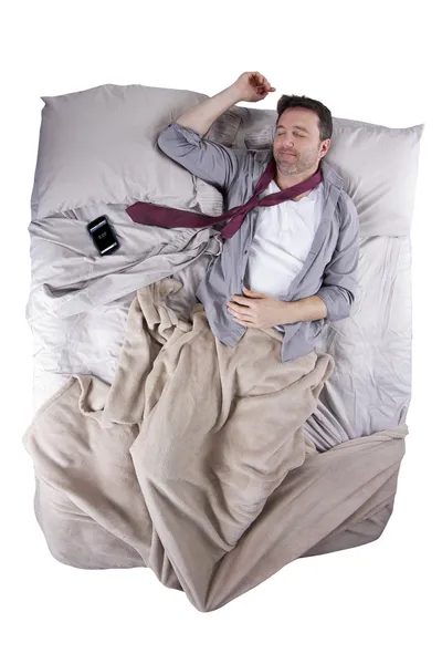 Businessman sleeping with cellphone alarm clock — Stock Photo, Image