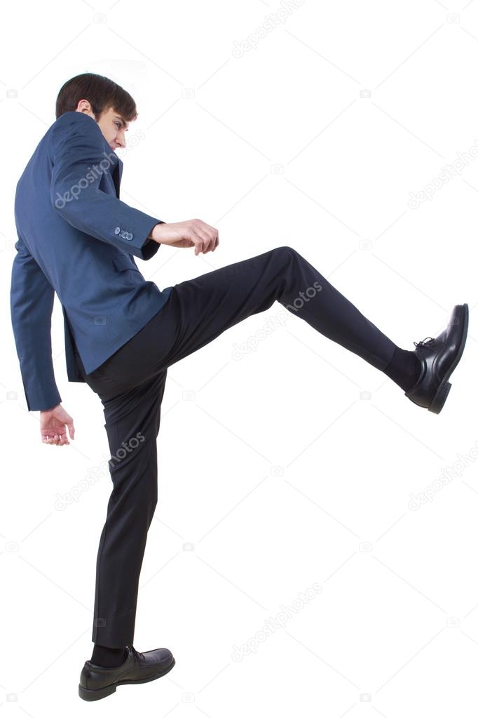 Businessman kicking pose