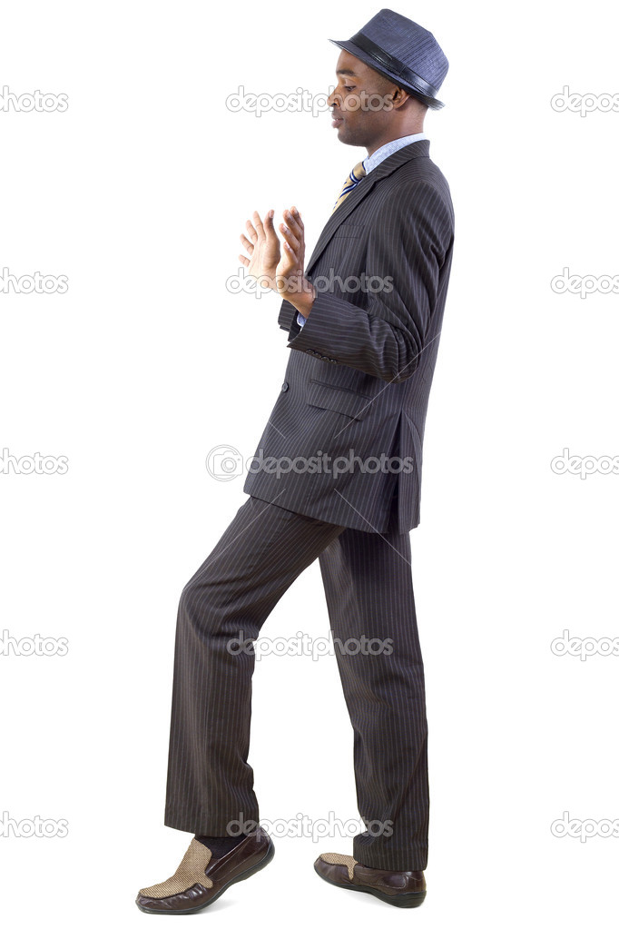 Businessman in a retreating or defensive gesture