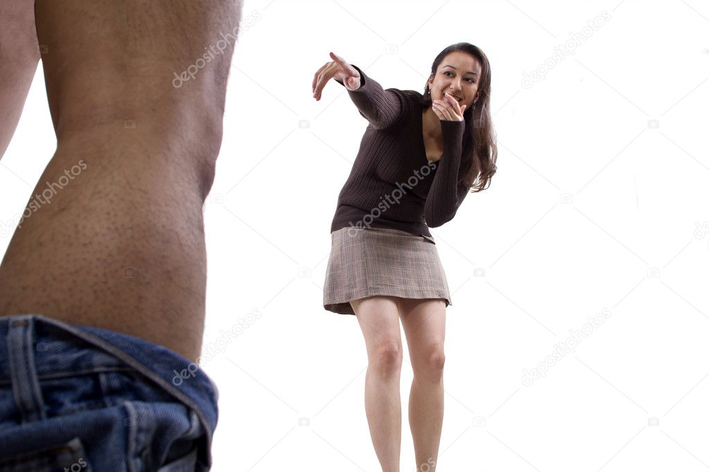 Man with pants down while woman makes fun of his manhood Stock Photo by