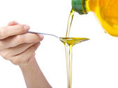 Woman pouring oil