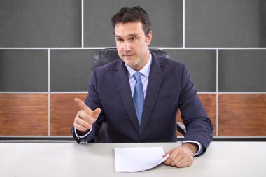 Male news anchor in studio clipart